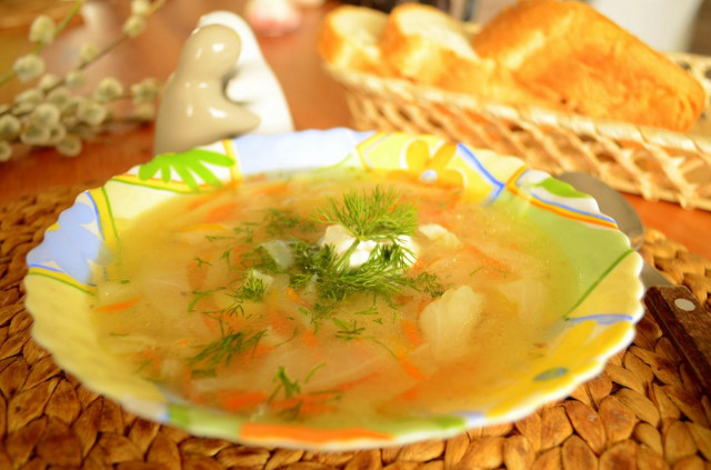 Sauerkraut soup with potatoes and chicken