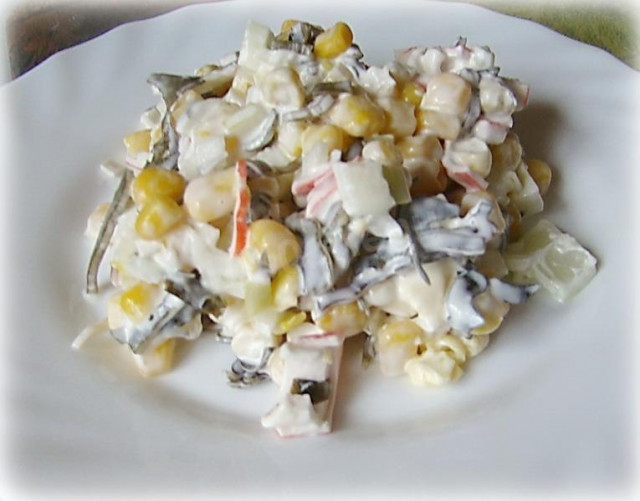 Seaweed salad with corn, mayonnaise and egg