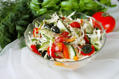 Salad with olives and tomatoes with young cabbage