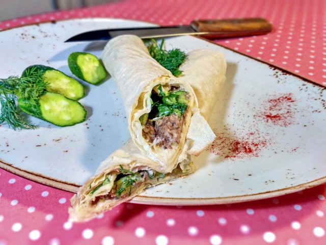 Lavash roll with canned fish and cucumber