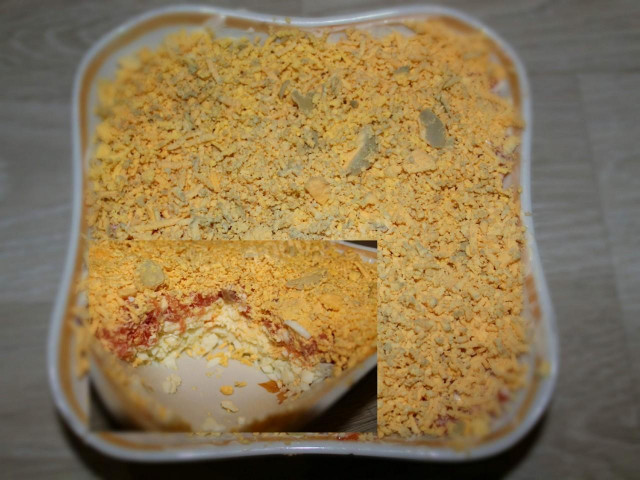 Salad with red fish, egg and cheese is tender