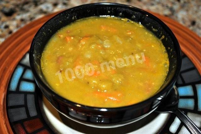Mashed pea soup in a slow cooker with basil and without meat