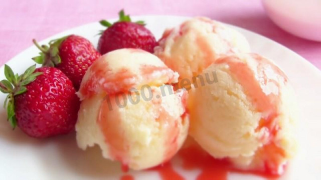 Homemade ice cream without cream with strawberry sauce