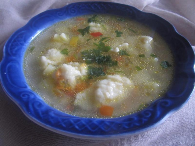 Soup with dumplings, pork, potatoes and bell peppers