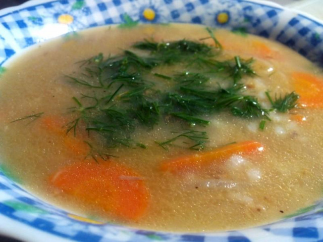 Soup with rice and carrots from canned fish