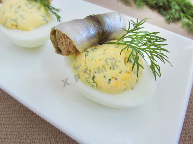 Stuffed eggs with rolls of lightly salted sprat