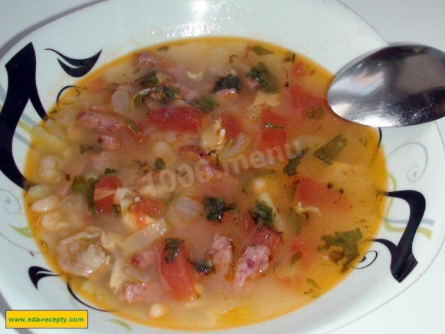 White bean soup with smoked sausage in broth