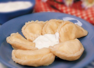 Fluffy dumplings with cottage cheese on milk