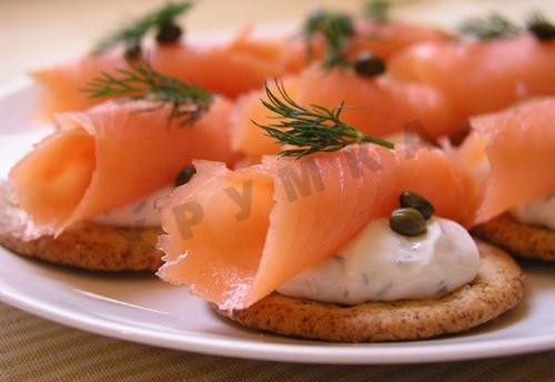 Canapes on a cracker with salmon for the New Year