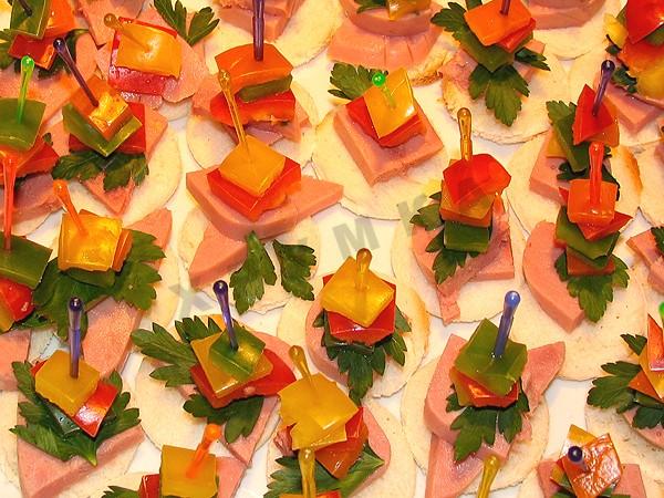 Canapes with ham and cheese and tomatoes