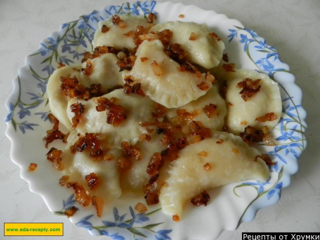 Delicious dumplings with potatoes, onion and bacon