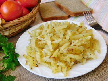 Fried potatoes with onions in a frying pan