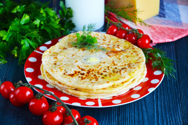Khachapuri on kefir in a pan with cheese