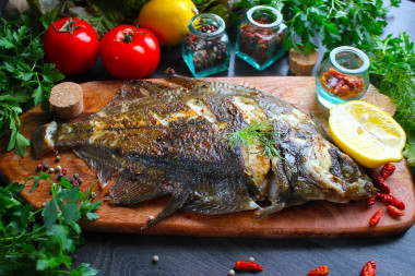 Whole flounder fried in a pan