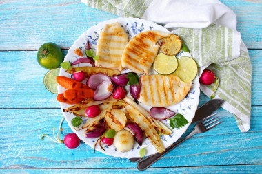 Fried squid in a pan with onions