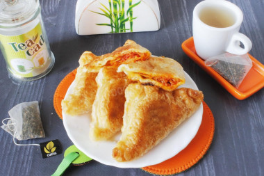 Puff pastry pies in a frying pan