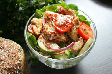 Salad with fried chicken breast and vegetables