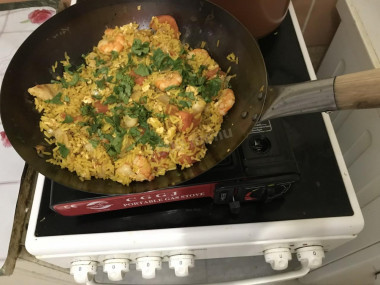 Fried rice with Thai seafood in a wok pan