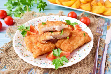 Fried pike perch in a frying pan