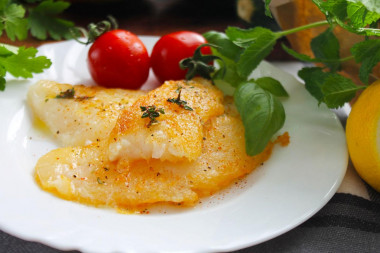 Halibut fillet fried in a frying pan