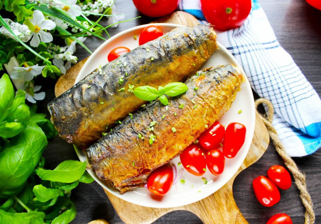 Fried mackerel in flour in a frying pan