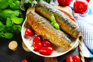 Fried mackerel in flour in a frying pan