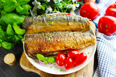 Fried mackerel in flour in a frying pan