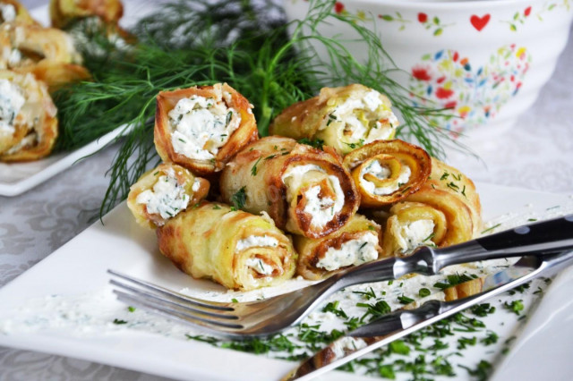 Fried zucchini rolls with cottage cheese and herbs