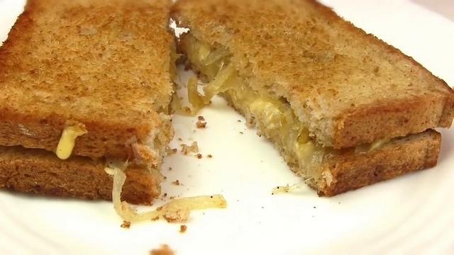 Fried sandwiches with cheese and onions