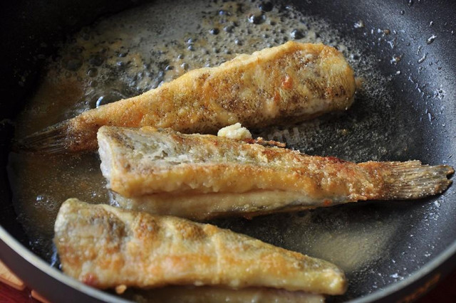 Fried nototenia in a frying pan