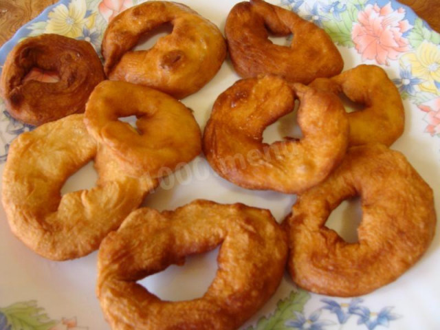 Fried yeast donuts in oil