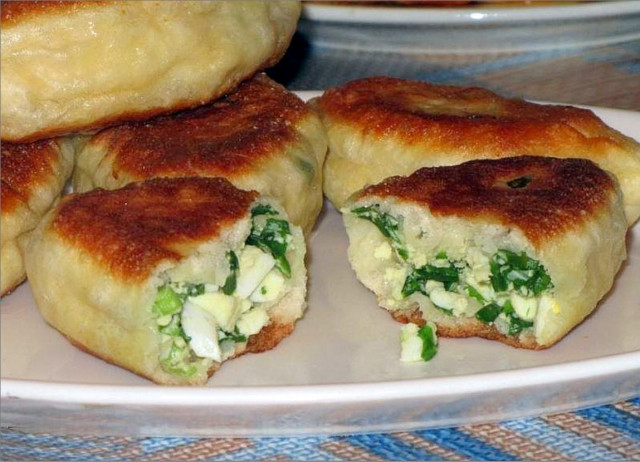 Fried pies with green onions and yeast eggs