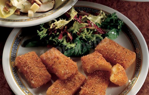 Fried Bitto cheese in breadcrumbs with sesame seeds