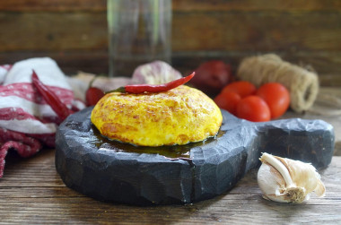 Fluffy omelet in a frying pan