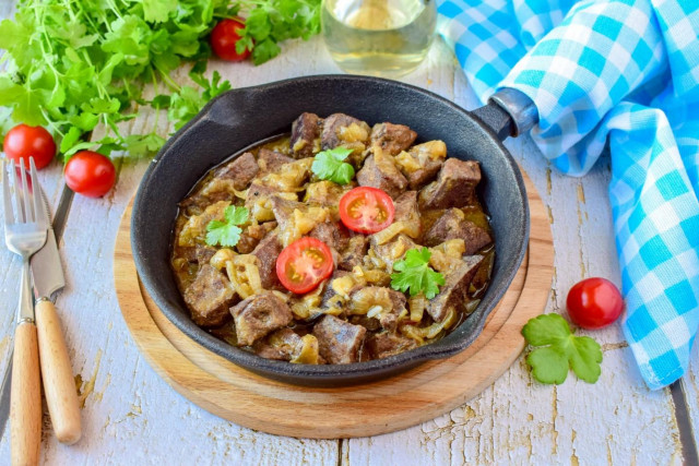Liver with onions in a frying pan