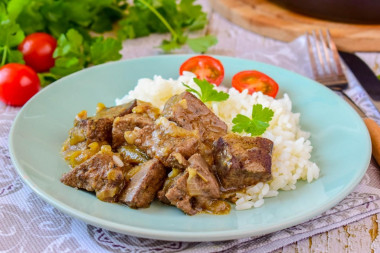 Liver with onions in a frying pan