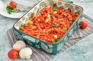 Meat in the oven with tomato cheese mushrooms