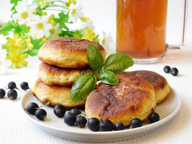 Simple cottage cheese pancakes with egg in a frying pan