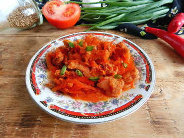 Pork meat with gravy in a frying pan