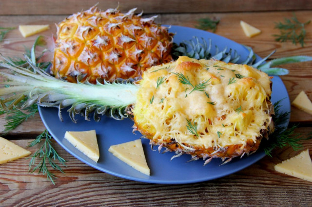 Baked pineapple with cheese in the oven for a holiday