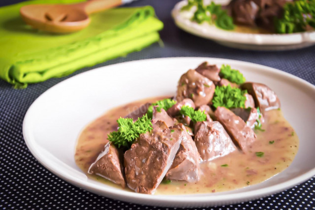 Beef liver with gravy in a frying pan