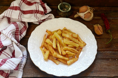 French fries in a frying pan at home