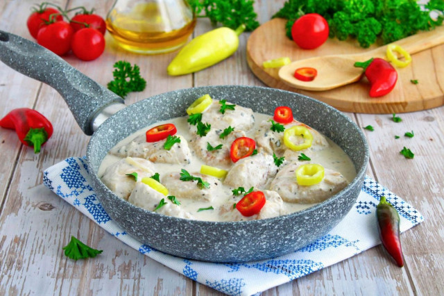 Stewed chicken breast in a frying pan