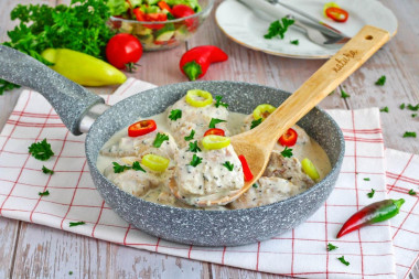 Stewed chicken breast in a frying pan