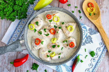 Stewed chicken breast in a frying pan