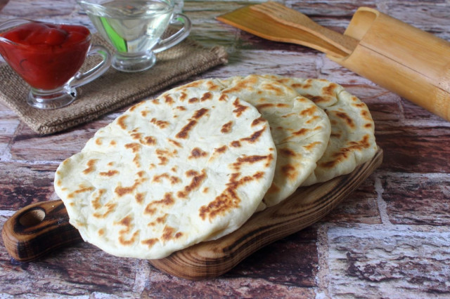 Tortillas with potatoes in a frying pan