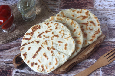 Tortillas with potatoes in a frying pan