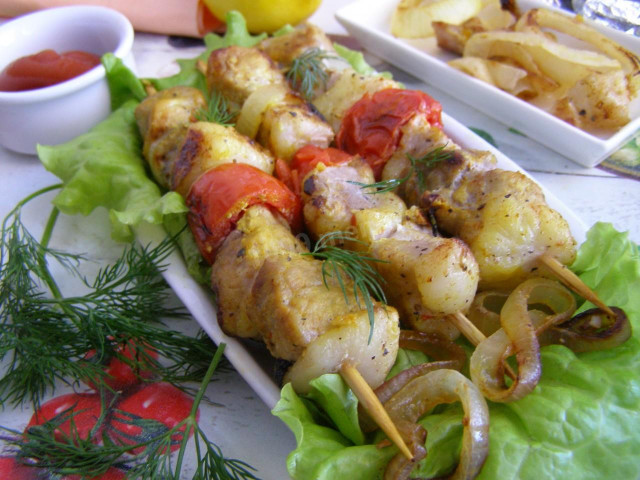 Pork kebab in foil in the oven is soft and juicy