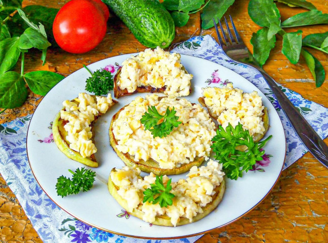 Zucchini with cheese in a frying pan with garlic