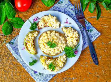 Zucchini with cheese in a frying pan with garlic